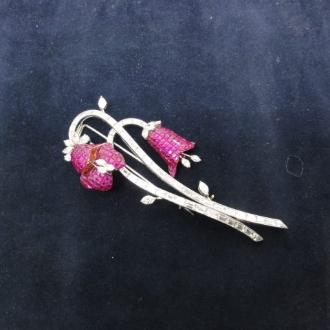 Spray flower brooch set with Rubies and baguette Diamonds