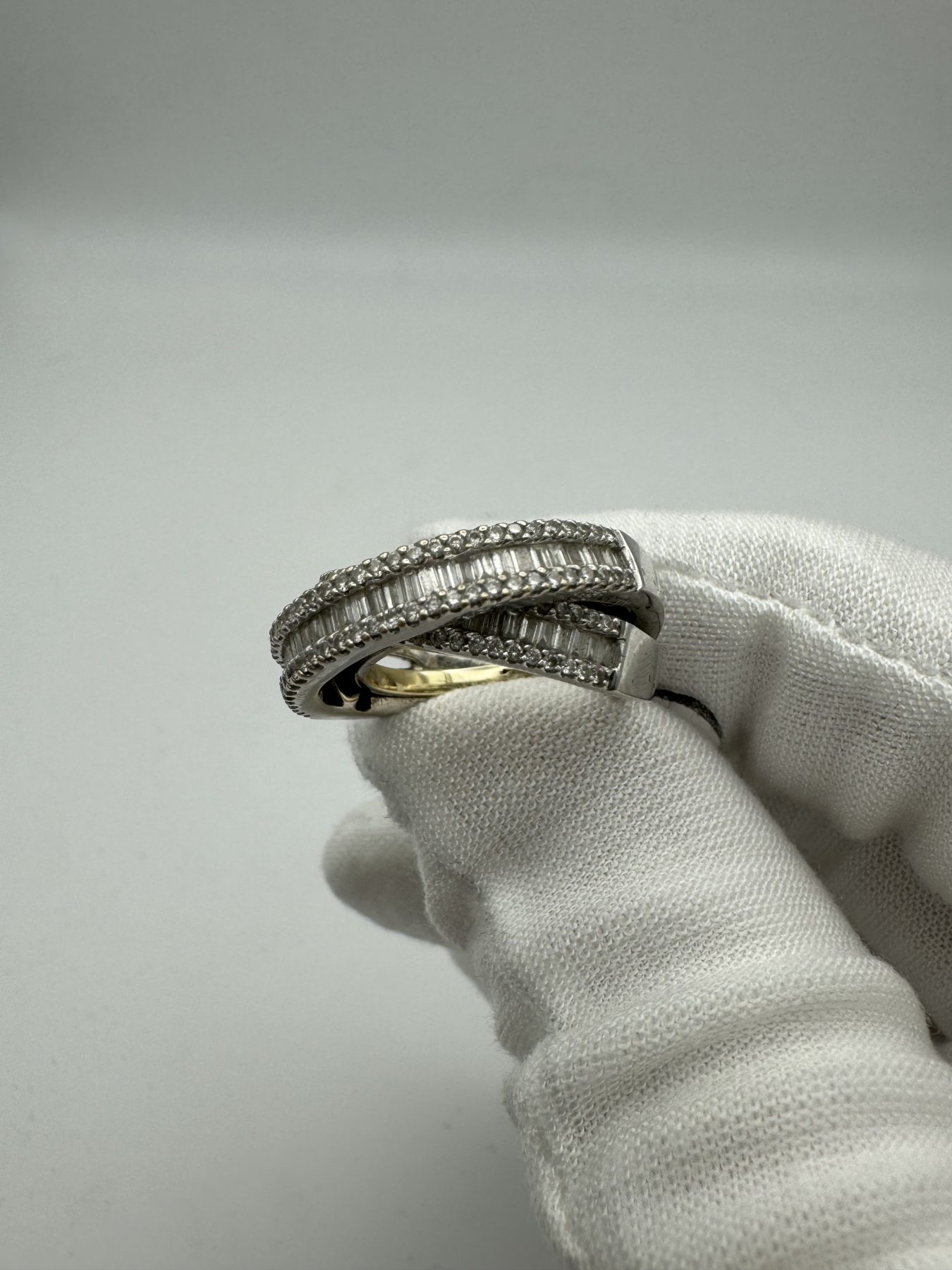 Round and Baguette Diamond Twist Ring
